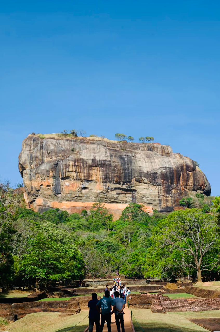Sigiriya rock fortress under a clear blue sky